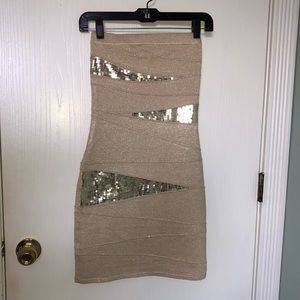 Gold shimmer strapless bandage dress with sequins.